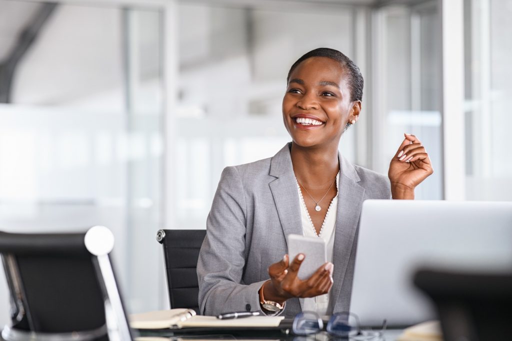 woman smiling at desk